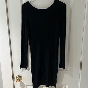 Black fitted light weight sweater dress with crisscross back detail